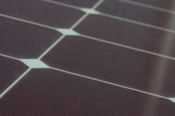 Detailed view of solar panel cells for alternative energy generation and innovation in technology.